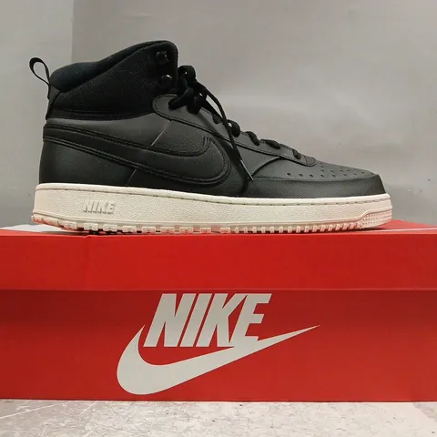 BOXED PAIR OF NIKE COURT VISION MID WNTR SHOES IN BLACK SIZE UK 11