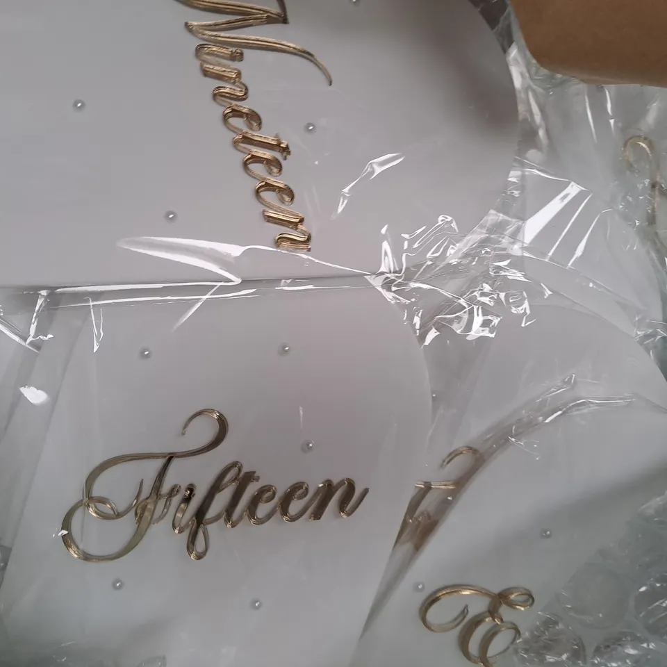 BOX OF APPROXIMATELY 20 PERSONALISED WEDDING TABLE NUMBERS AND GUEST BOOK