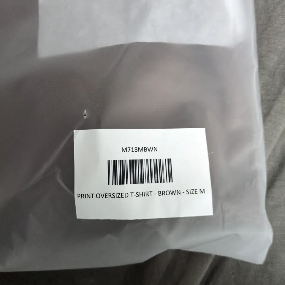 LEGEND PRINT OVERSIZED T-SHIRT – BROWN – SIZE M