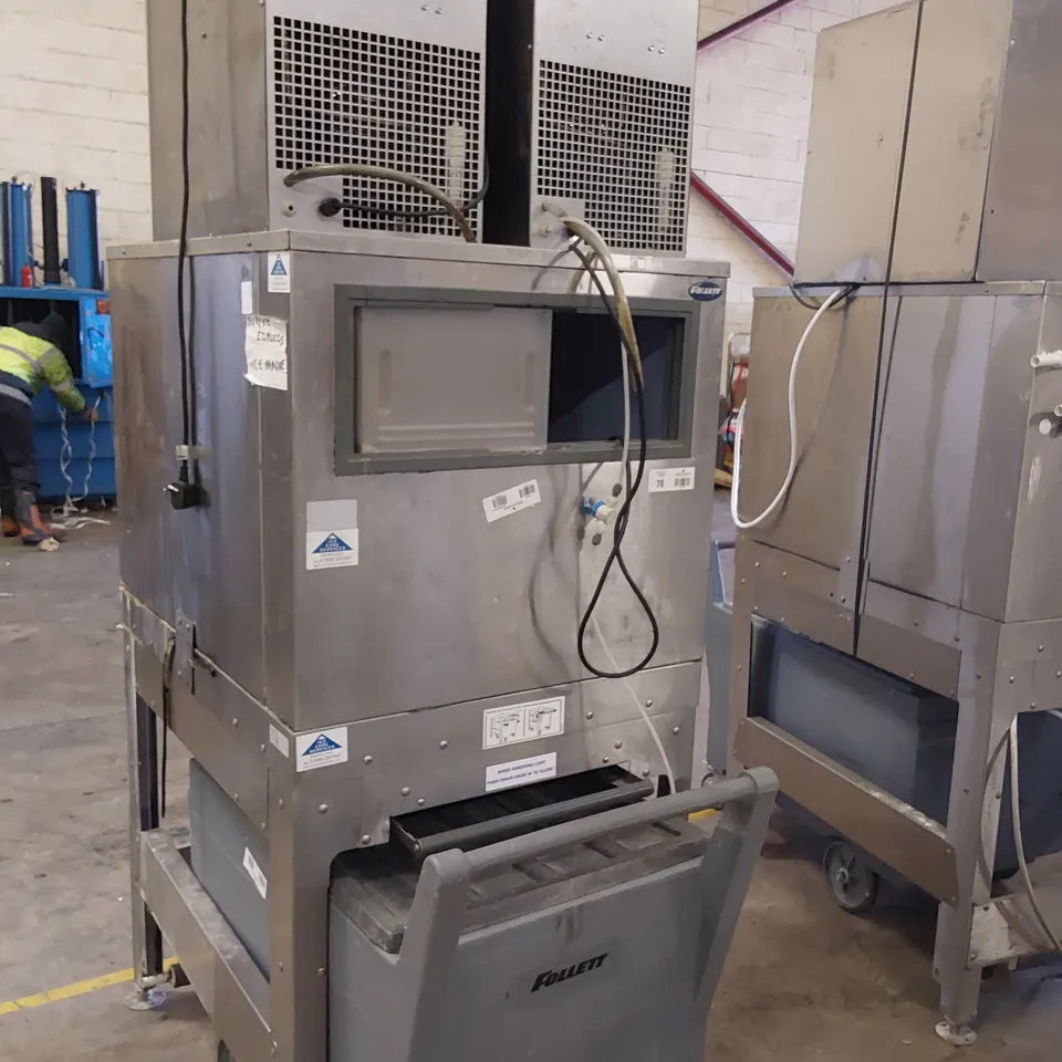 FOLLETT COMMERCIAL ICE MACHINE ON STAND WITH ICE TROLLEY