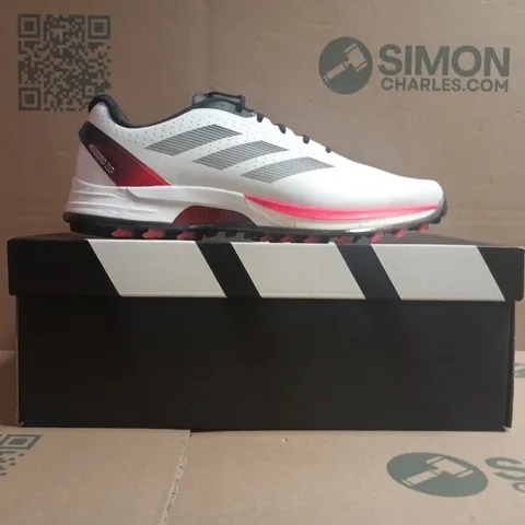 BOXED PAIR OF ADIDAS R2C TRAINERS IN WHITE/BLACK/RED SIZE UK 10