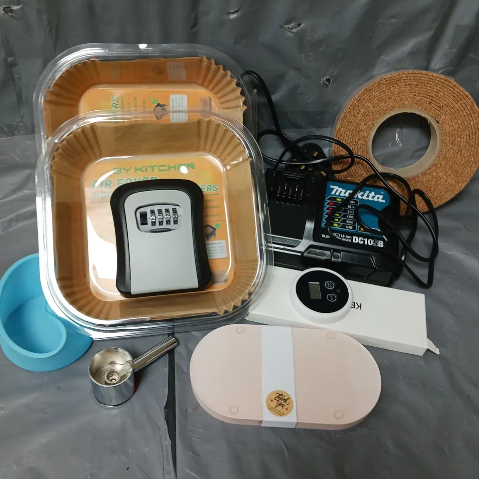 APPROXIMATELY 12 ASSORTED HOUSEHOLD ITEMS TO INCLUDE MAKITA BATTERY CHARGER, DISPOSABLE PAPER LINE, COMBINATION KEY SAFE, ETC