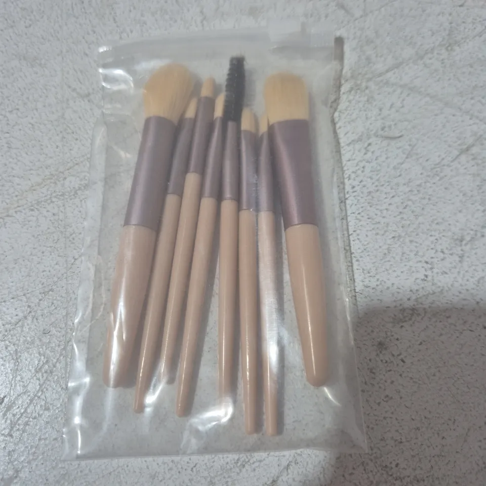 LOT OF APPROXIMATELY 40 8-PIECE MAKE UP BRUSH SETS WITH PALE PINK CARRY CASES