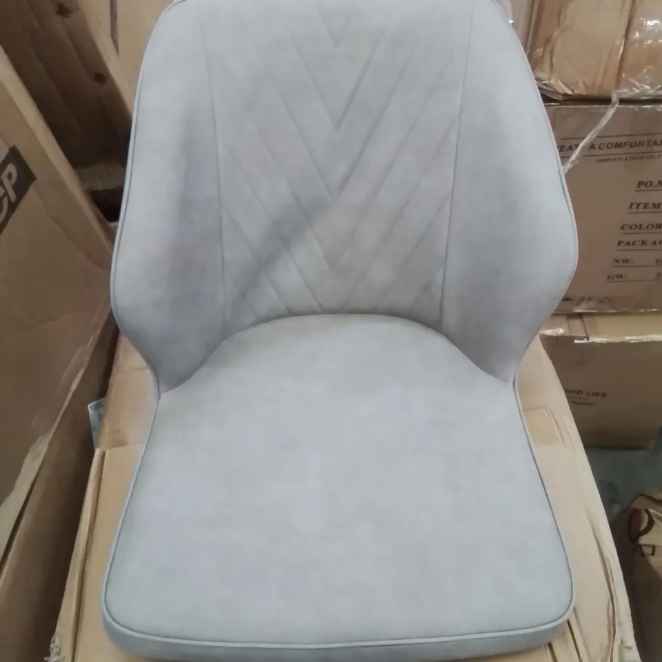 A BOXED PAIR OF LIGHT GREY FAUX LEATHER UPHOLSTERED SIDE CHAIRS