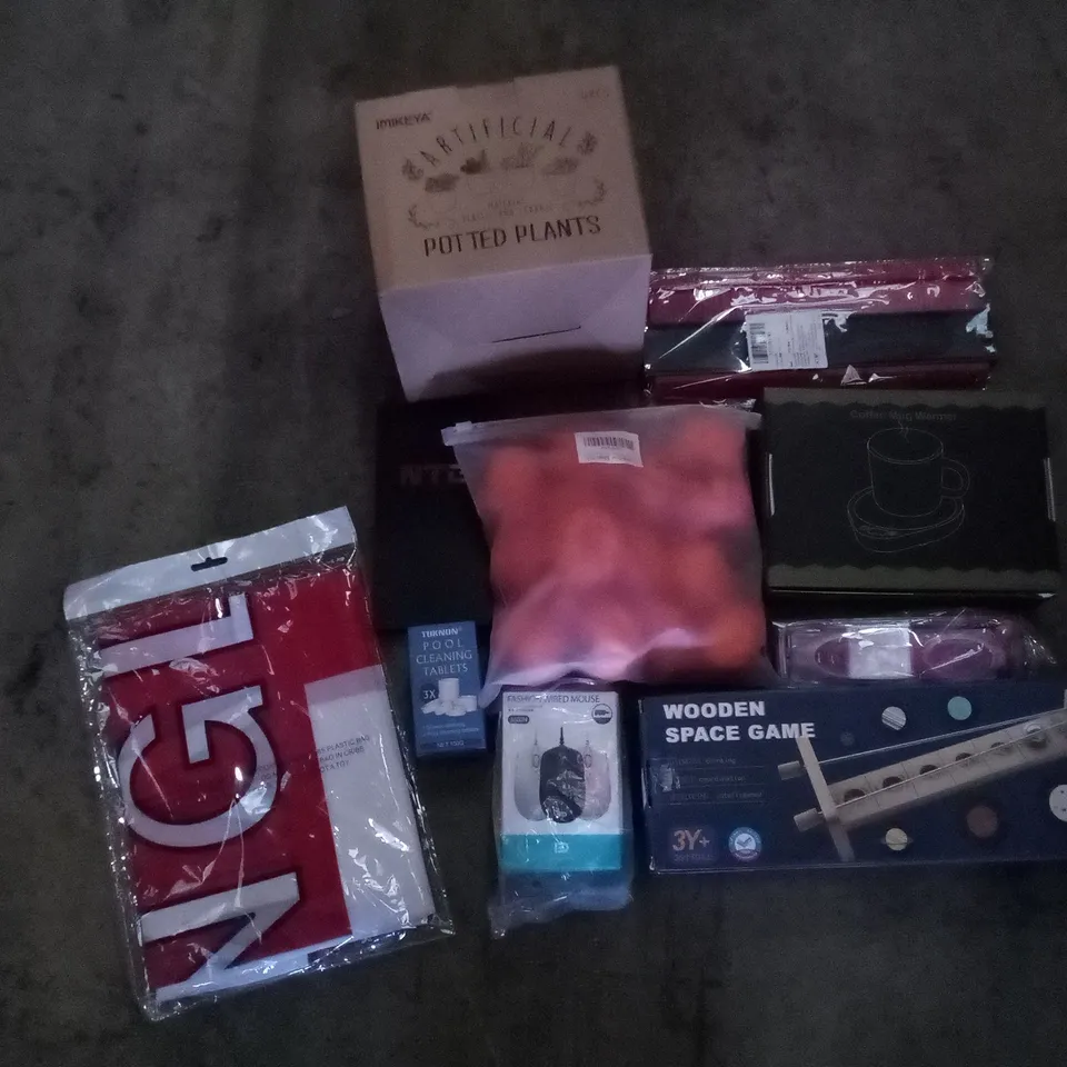 PALLET OF 6 BOXES CONTAINING ASSORTED ITEMS INCLUDING ARTIFICIAL POTTED PLANT, ENGLAND FLAG, WOODEN SPACE GAME, COFFEE MUG WARMER, CONTOUR RULER, WIRED MOUSE
