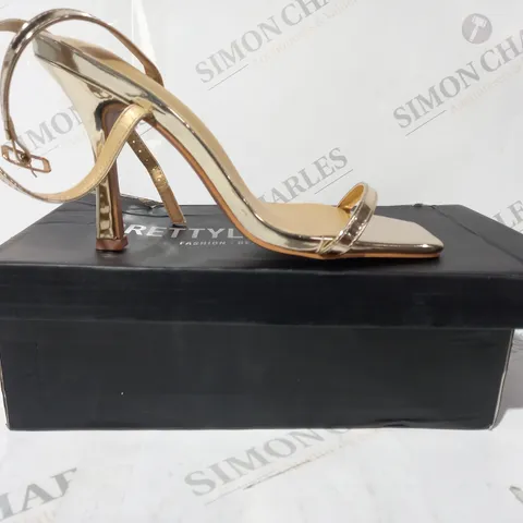 BOXED PAIR OF PRETTY LITTLE THING OPEN TOE STRAPPY HIGH HEEL SANDALS IN METALLIC GOLD SIZE 5