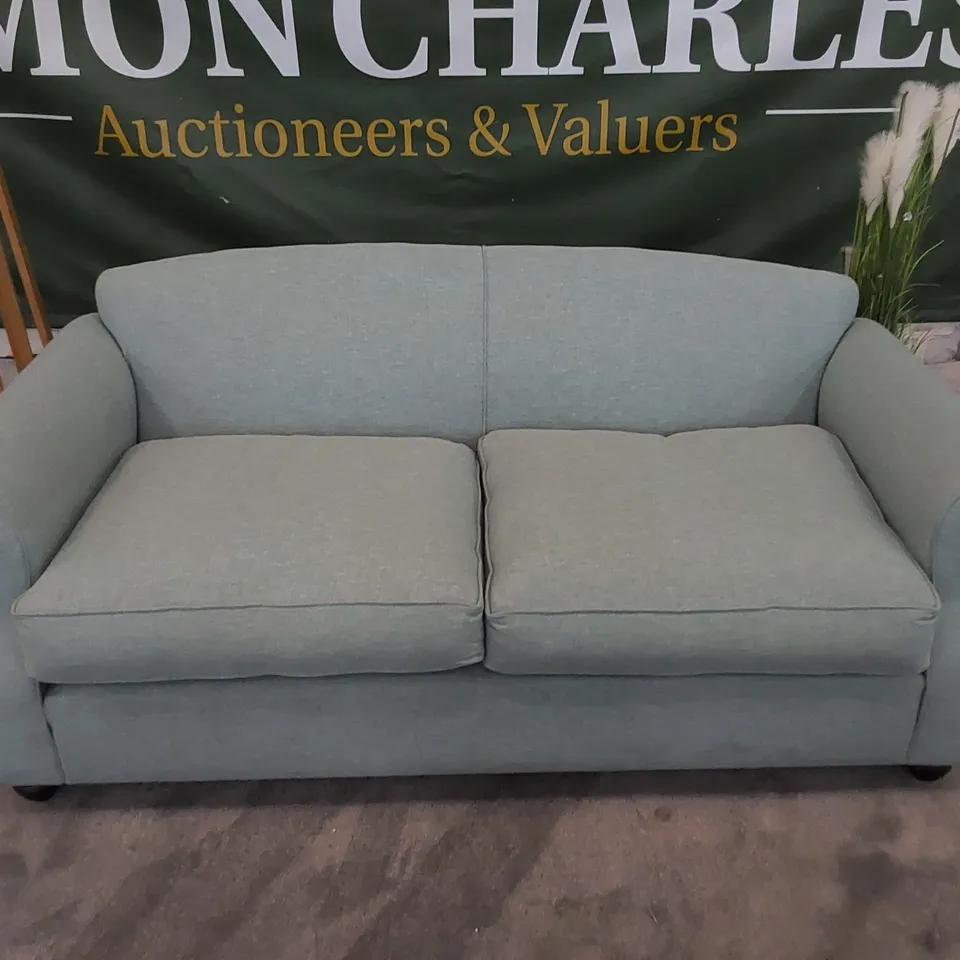 THE CHILMARK 3-SEATER SOFA UPHOLSTERED IN AQUA FABRIC