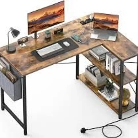 BOXED L-SHAPED COMPUTER DESK WITH POWER OUTLET.