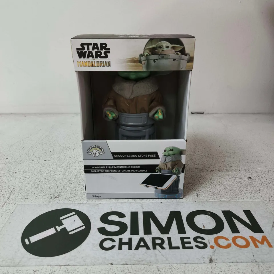 APPROXIMATELY 6 BOXED GROGU SEEING STONE POSE FIGURES– STAR WARS MANDALORIAN PHONE & CONTROLLER HOLDERS