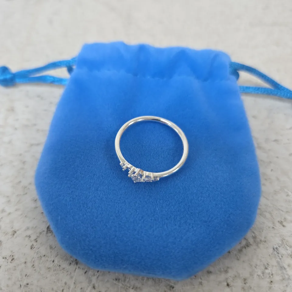 SILVER-TONE RING WITH ROW OF SMALL STONES