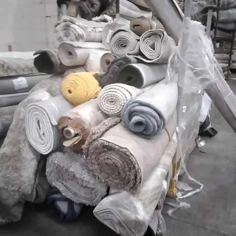 STILLAGE OF APPROXIMATELY 30 DESIGNER RUGS
