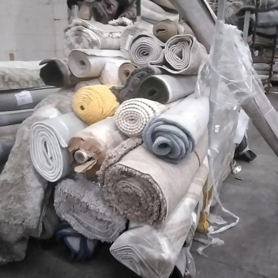STILLAGE OF APPROXIMATELY 30 DESIGNER RUGS