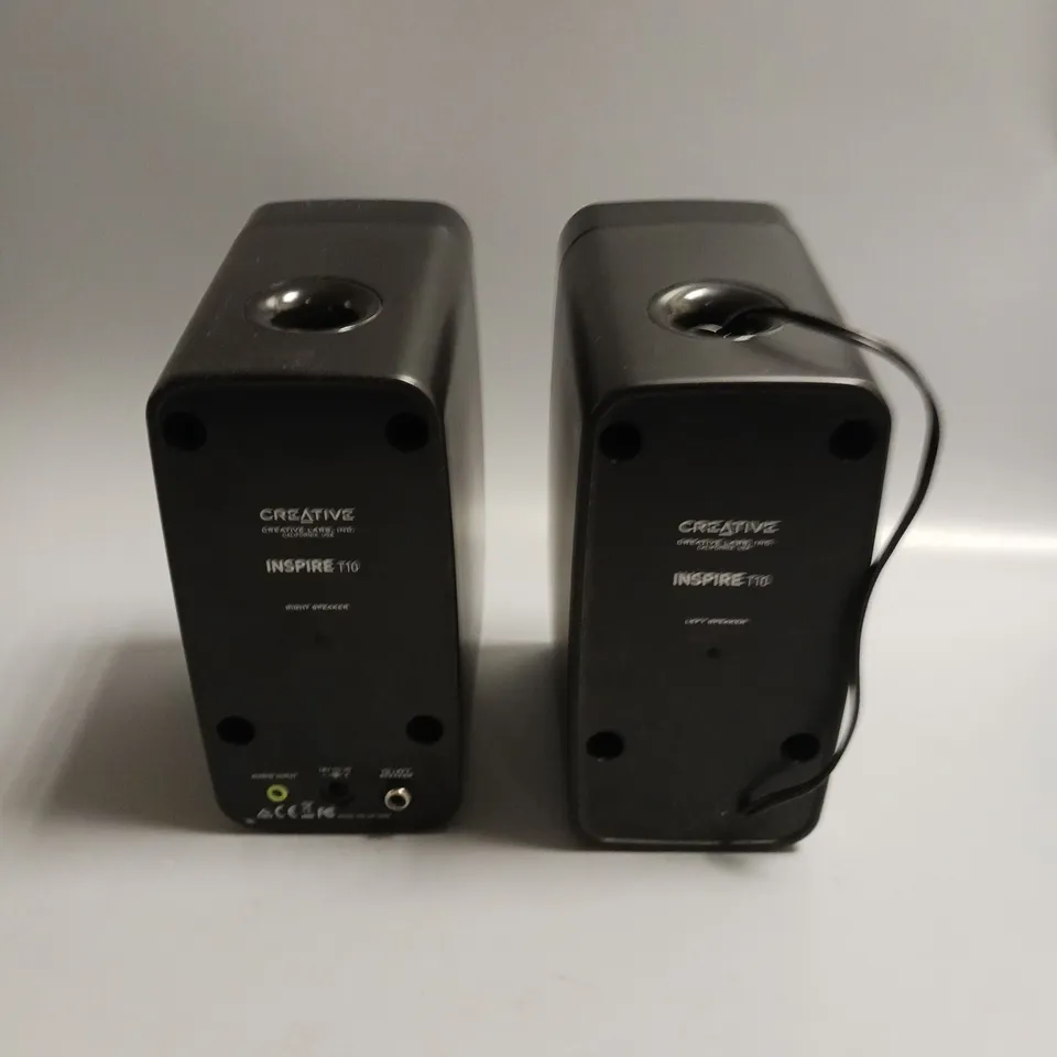 PAIR OF CREATIVE PLUG-IN SPEAKERS IN BLACK