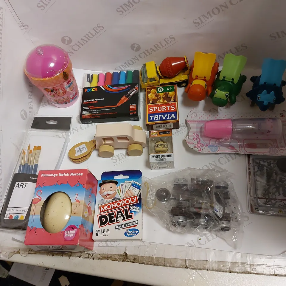 TOTE OF MANY ASSORTED TOYS TO INCLUDE POSCA MARKERS, CRY BABIES SET, AND MONOPOLY DEAL ETC. 