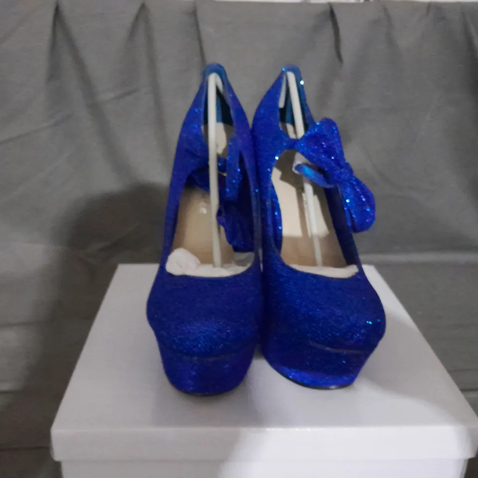 APPROXIMATELY 10 BOXED PAIRS OF KOI WEDGE SHOES IN VARIOUS SIZES TO INCLUDE SIZE 6