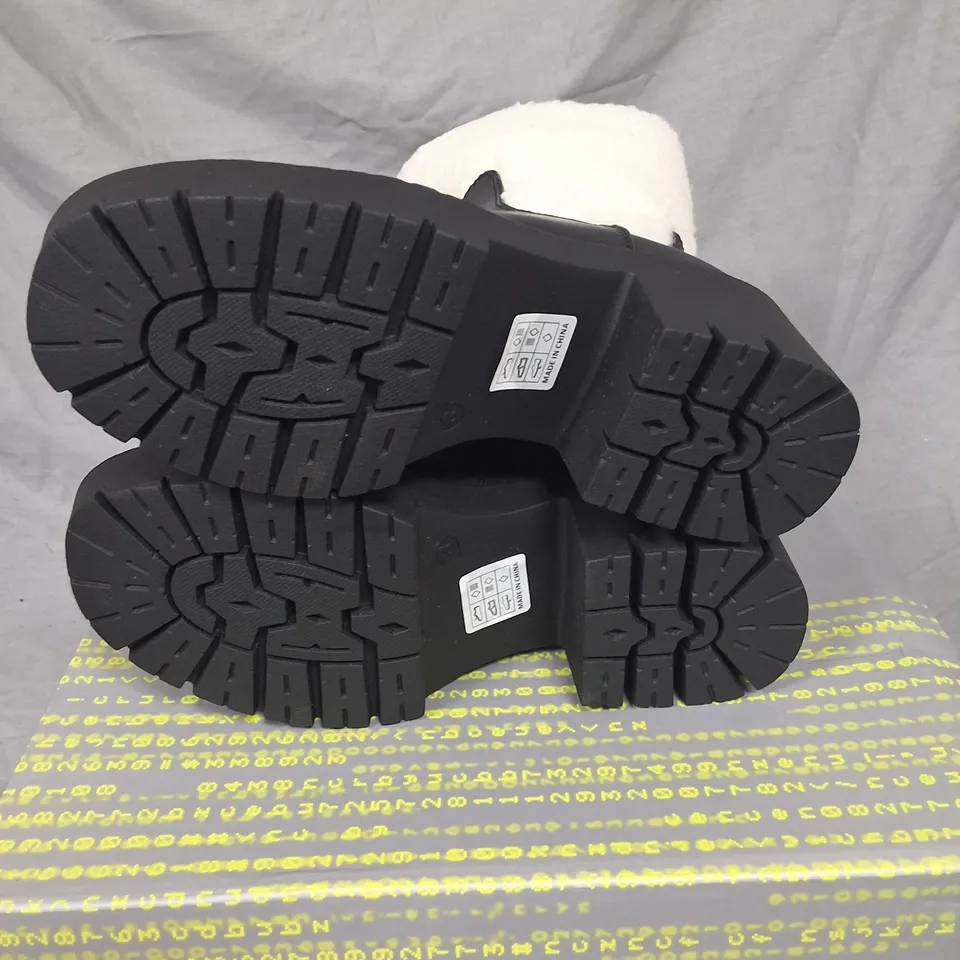 PAIR OF KOI TEXEL SHEARLING SWITCH BOOTS IN BLACK SIZE UK 3