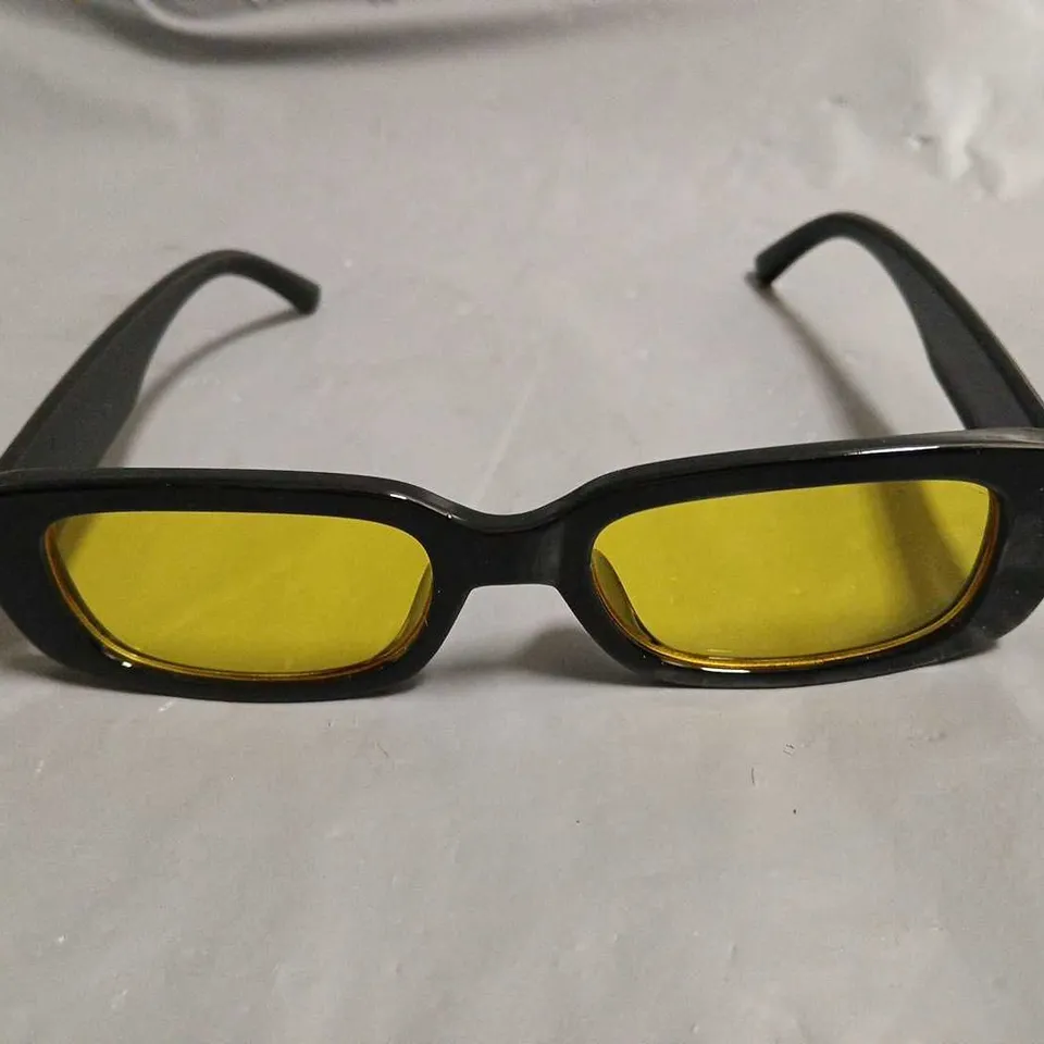 BOXED PAIR OF EYEKONIK BLACK FRAMED GLASSES WITH YELLOW TINT LENS