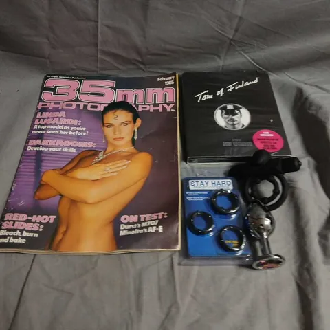BOX OF APPROX 10 ASSORTED ADULT ACCESSORIES TO INCLUDE MAGAZINES, DVDS AND BUTT PLUGS 