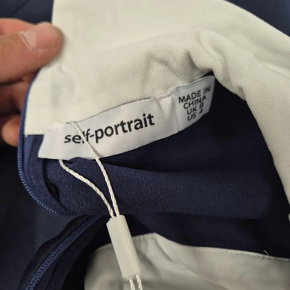 SELF-PORTRAIT NAVY DRESS WITH WHITE PLEATED SKIRT, UK 6