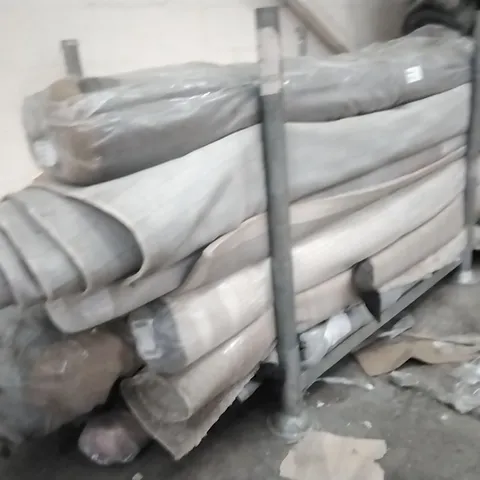 STILLAGE OF APPROXIMATELY 20 DESIGNER RUGS