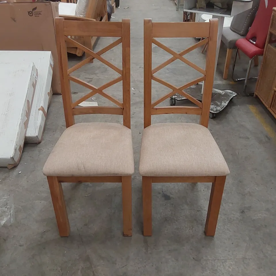 PAIR OF DESIGNER CROSS BACK WOODEN DINING CHAIRS WITH UPHOLSTERED PADDING