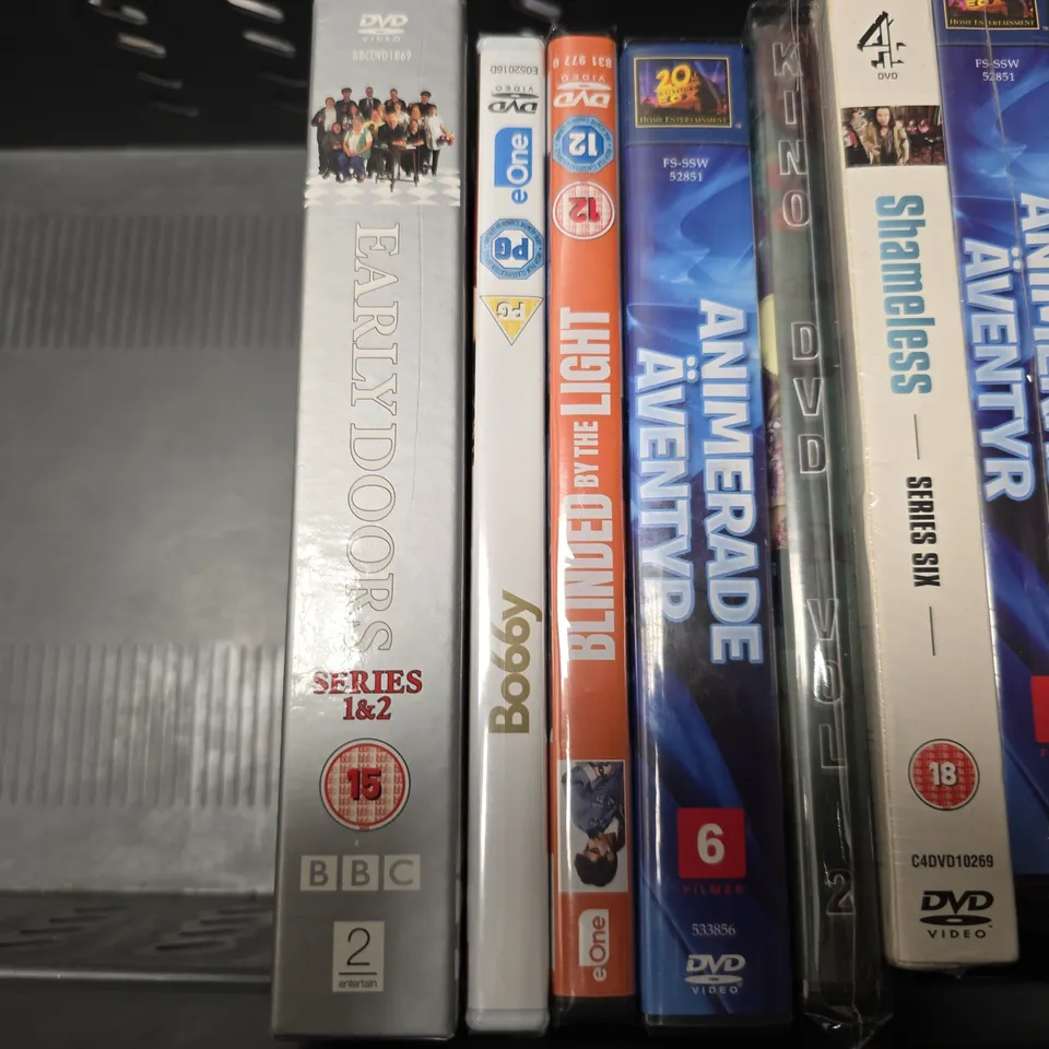 TOTE OF APPROXIMATELY 11 ASSORTED DVD'S TO INCLUDE - DOG MAN , BLINDED BY THE LIGHT , MRS BROWNS BOYS ETC
