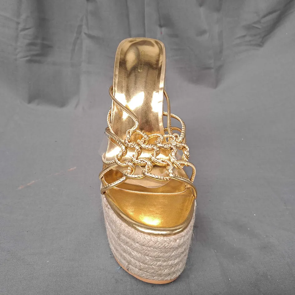 BOXED PAIR OF DESIGNER HIGH WEDGE SANDALS IN METALLIC GOLD SIZE 6