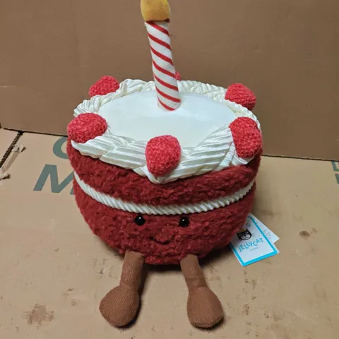 JELLYCAT LONDON CHERI CAKE PLUSH TOY – RED CAKE WITH CANDLE