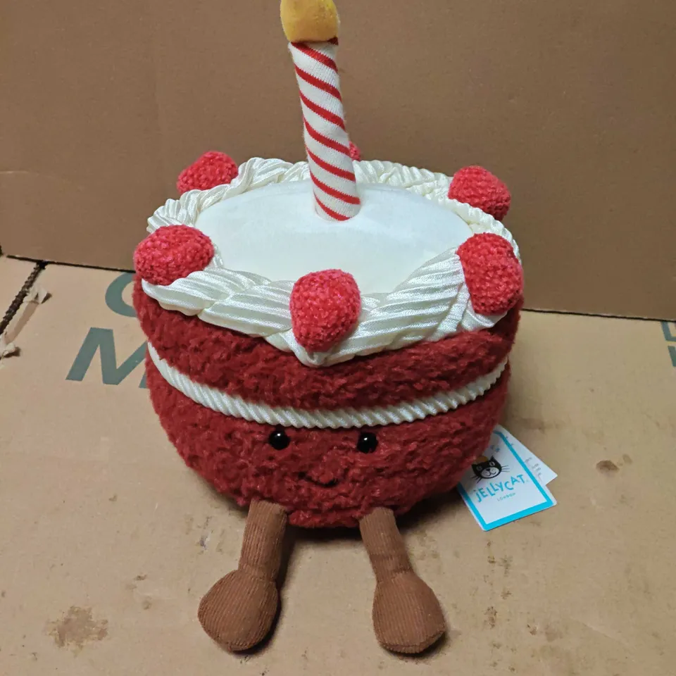 JELLYCAT LONDON CHERI CAKE PLUSH TOY – RED CAKE WITH CANDLE