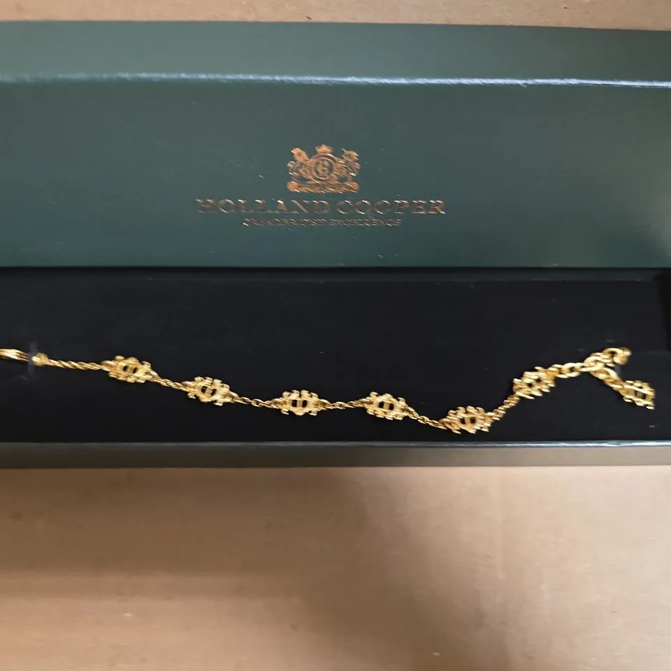 BOXED HOLLAND COOPER FONE HERALDIC HC BRACELET IN VINTAGE GOLD COLOUR