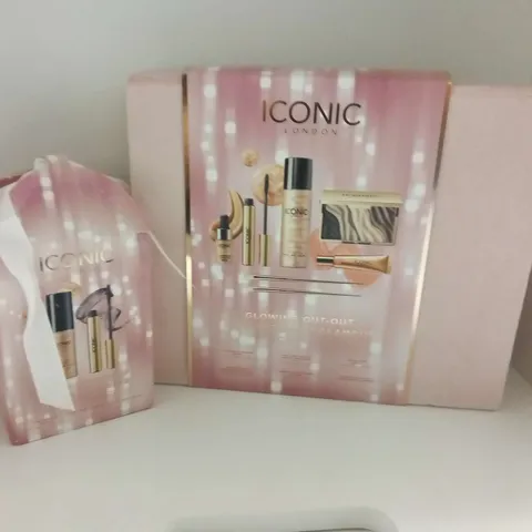 TWO ASSORTED ICONIC BEAUTY PRODUCTS TO INCLUDE; GLOWING OUT-OUT AND ALL WRAPPED UP