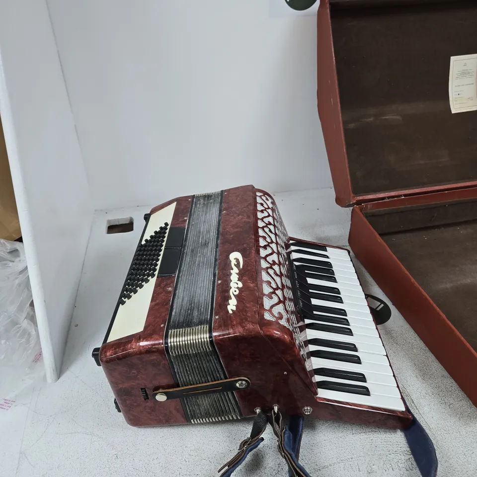 ANTIQUE RUSSIAN GARMON ACCORDION WITH RED MARBLED EXTERIOR AND STRAP – WITH HARD CASE MANUFACTURED IN LENINGRADKOYE 