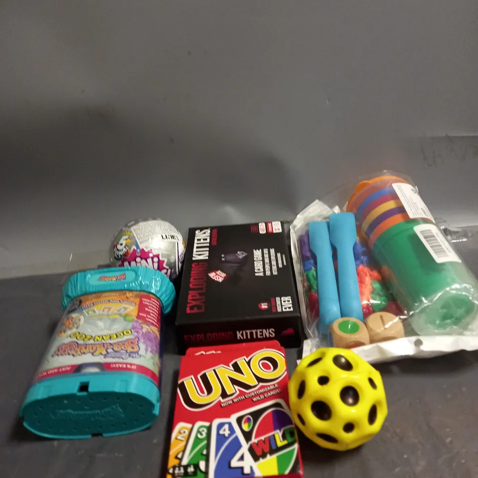 BOX OF ASSORTED TOYS AND GAMES TO INLCUDE CARD GAME, MINI BRANDS AND SEA MONKEYS