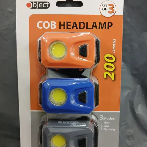 BOX OF APPROXIMATELY 24 PACKS OF OBJECT COB HEADLAMPS IN VARIOUS COLOURS (3 PER PACK)