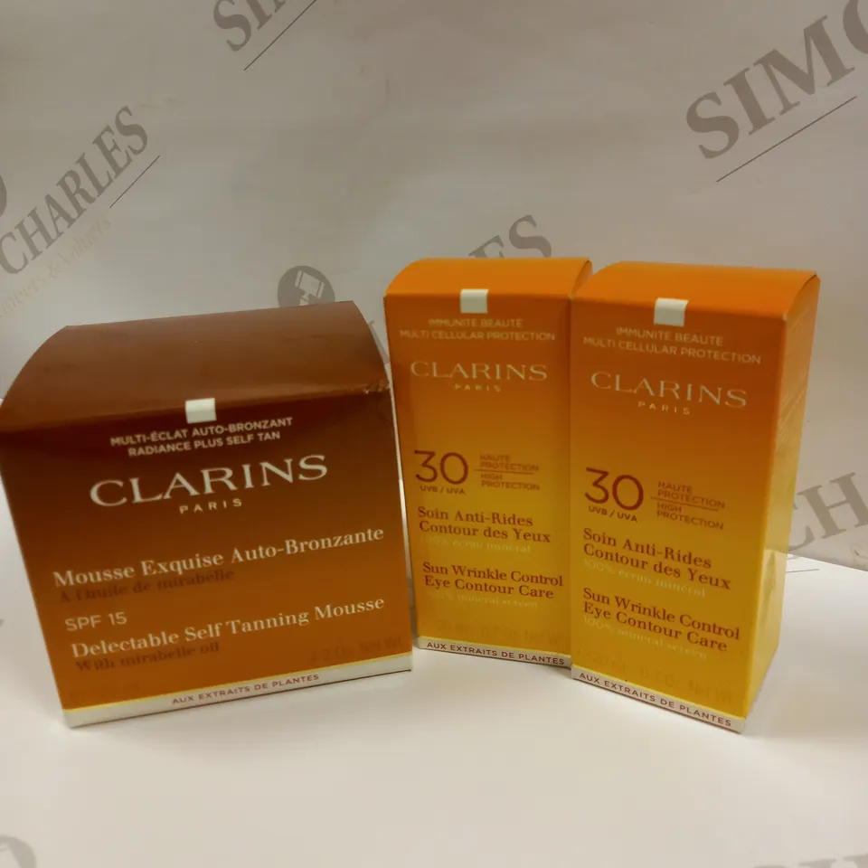TANNING BUNDLE APPROX 3 CLARINS PARIS SKINCARE ITEMS TO INCLUDE SELF TANNING MOUSSE WITH SPF 15 125ML  AND SUN WRINKLE CONTROL EYE CONTOUR CARE 20ML