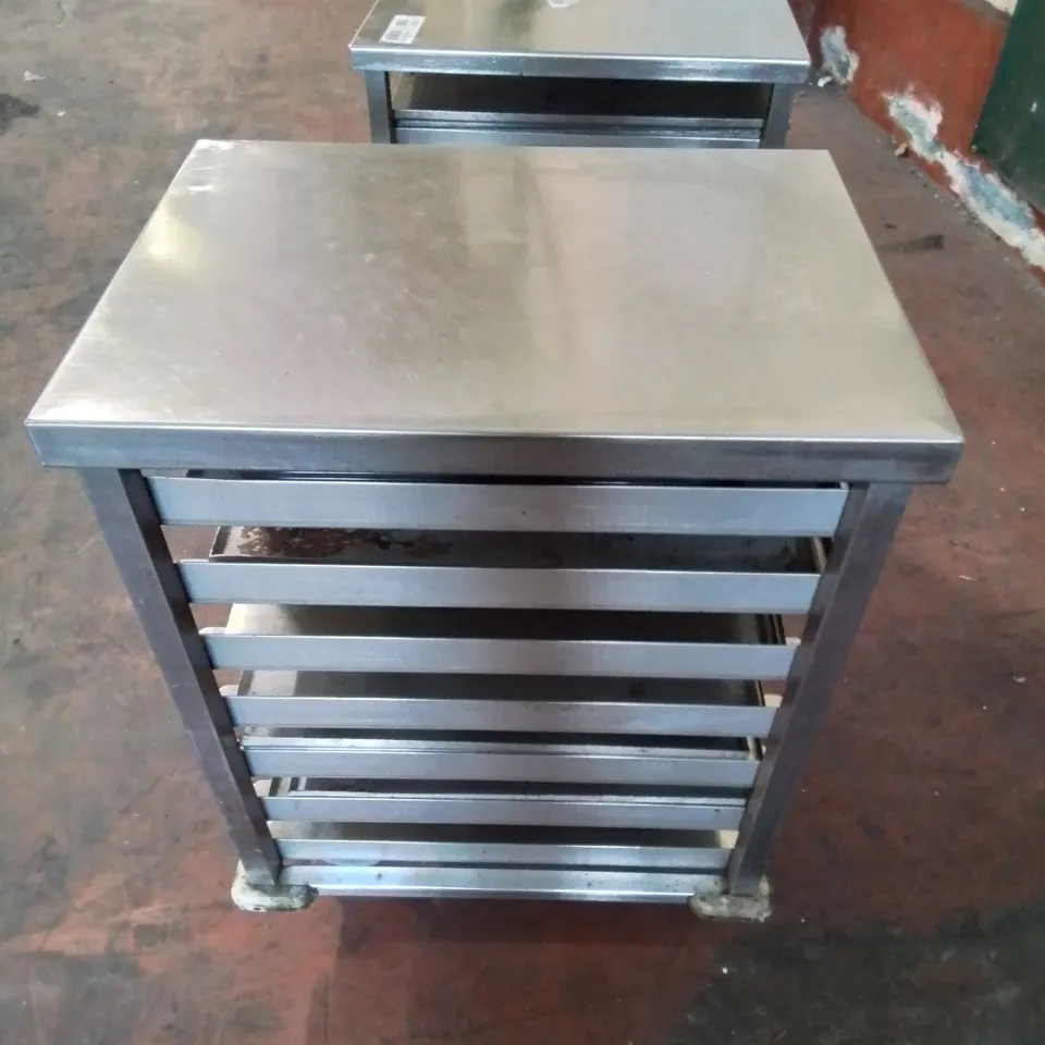 PAIR OF STAINLESS STEEL COMMERCIAL COOKING TRAY TROLLEYS WITH LARGE AMOUNT OF METAL OVEN TRAYS