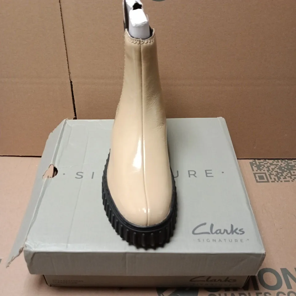 BOXED PAIR OF CLARKS TORHILL MAPLE BOOTS IN BEIGE PATENT - UK 4.5