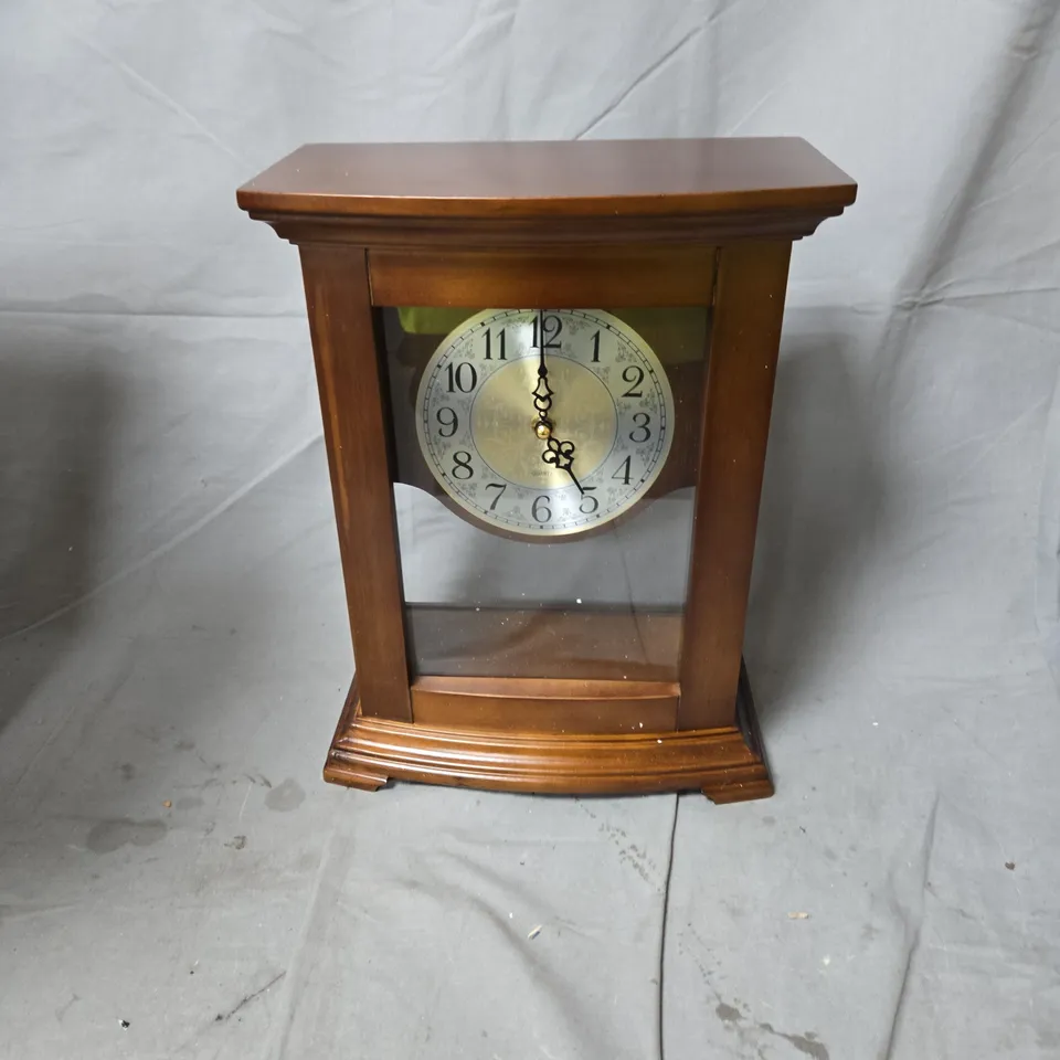 WOODEN MANTEL CLOCK WITH GLASS-FRONT DISPLAY AND BRASS DIAL