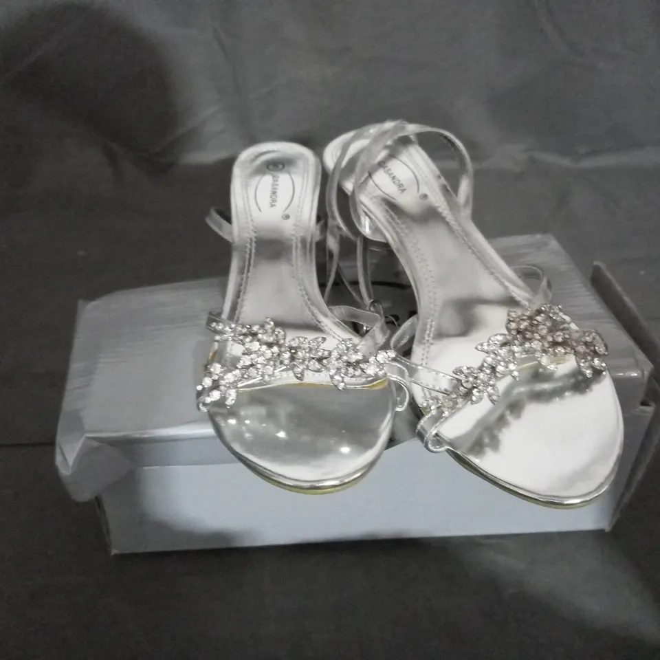 APPROXIMATELY 10 BOXED PAIRS OF CASANDRA SILVER SANDALS IN VARIOUS SIZES TO INCLUDE SIZE 5 