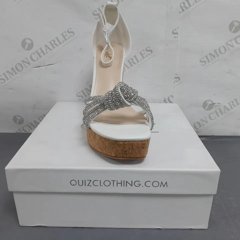 BOXED PAIR OF QUIZ OPEN TOE HIGH WEDGE SANDALS IN WHITE W. JEWEL EFFECT SIZE 7