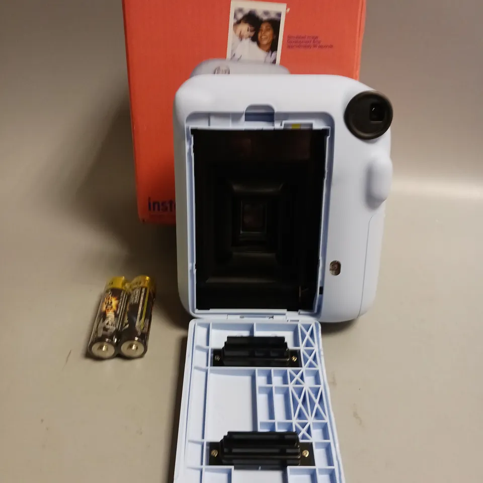 FUJIFILM INSTAX MINI 12 IN PASTEL BLUE INCLUDES BATTERIES