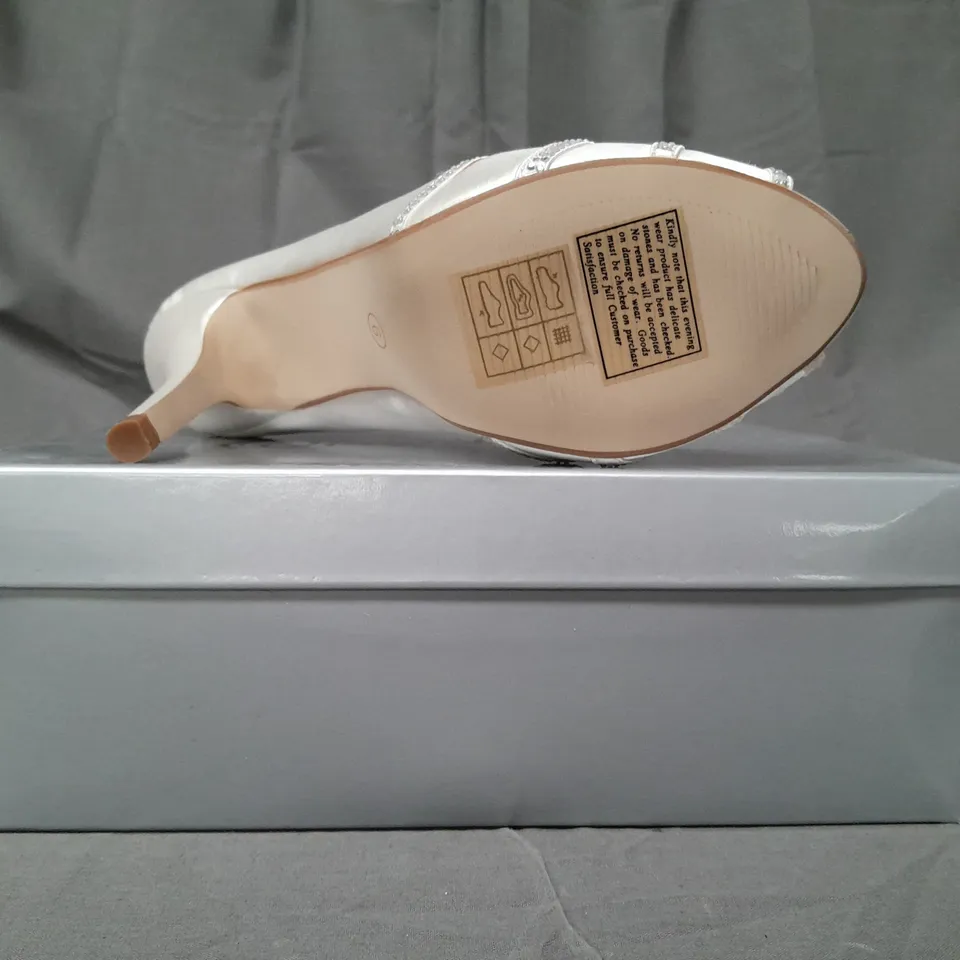 BOX OF APPROXIMATELY 10 BOXED PAIRS OF OCCASIONS BY CASANDRA PEEP TOE HIGH HEEL SHOES IN IVORY SATIN W. JEWEL EFFECT - VARIOUS SIZES