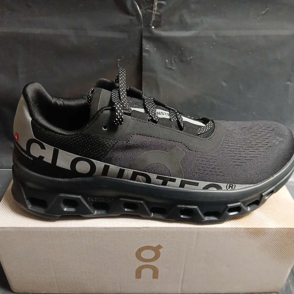 BOXED PAIR OF ON RUNNING CLOUDMONSTER TRAINERS – BLACK/SILVER, UK 10.5 (US 11)