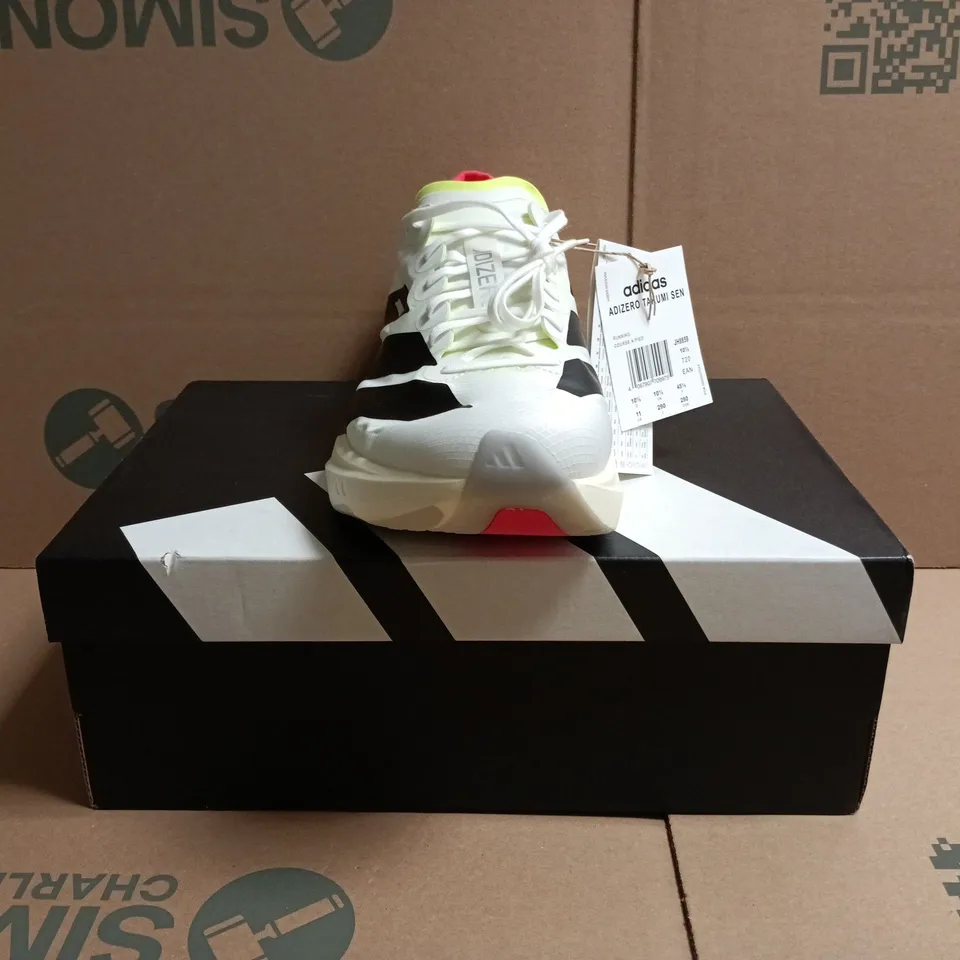 BOXED PAIR OF ADIDAS ADIZERO TAKUMI SEN TRAINERS IN WHITE/BLACK/MULTI SIZE UK 10.5