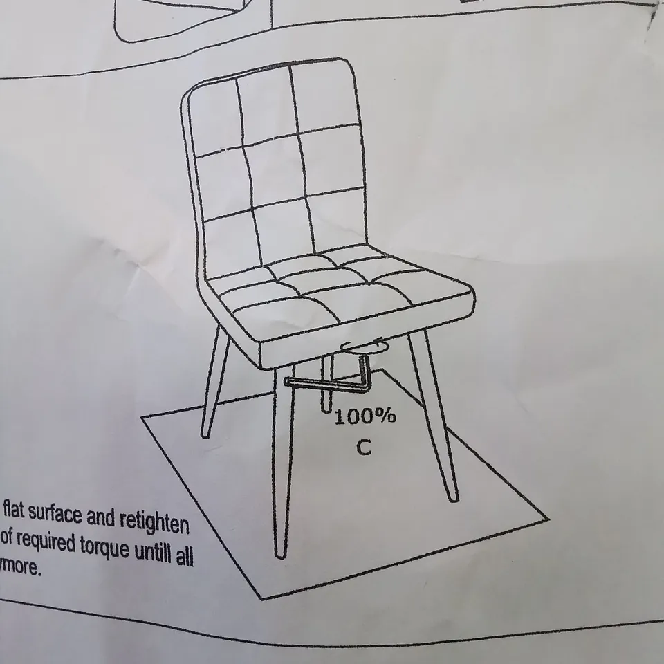 A BOXED GREY FABRIC UPHOLSTERED CHAIR 