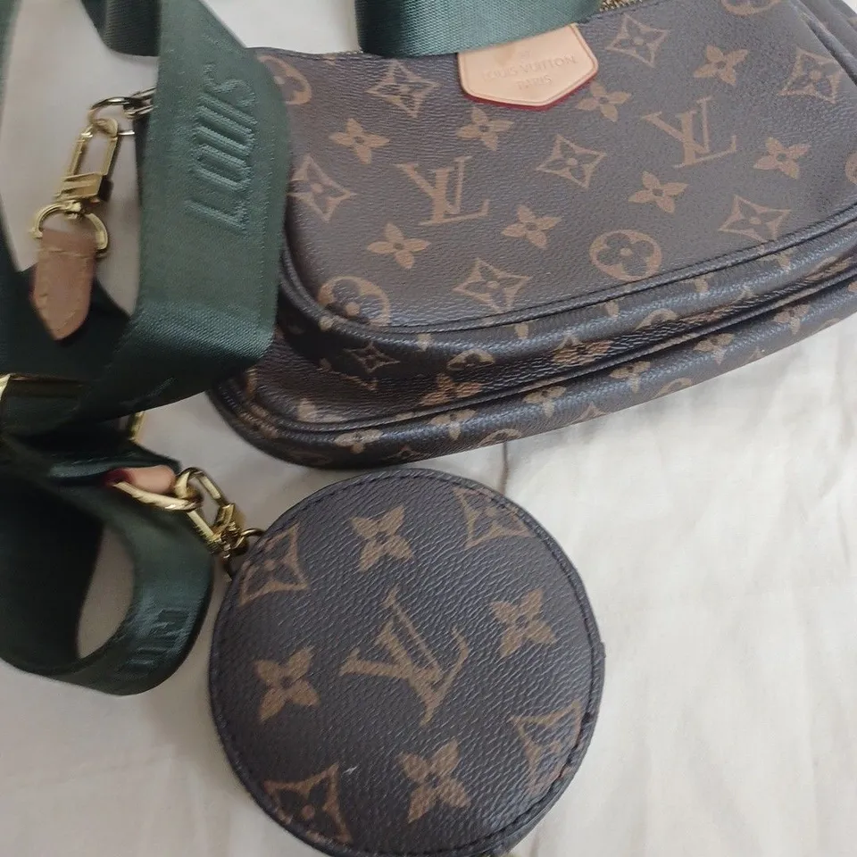 louis Vuitton hand bag in brown with green strap 