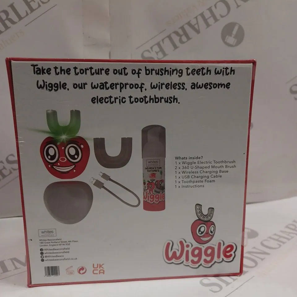BOXED AND SEALED “WIGGLE” CHILDREN'S ELECTRIC TOOTHBRUSH