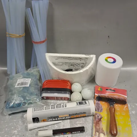 ASSORTED HOUSEHOLD ITEMS TO INCLUDE CONSTRUCTION ADHESIVE, GOLF BALLS, PET GROOMING BRUSH, ETC 