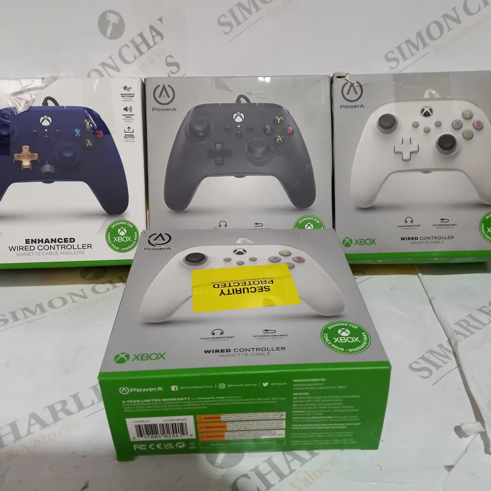 4 BOXED WIRED XBOX CONTROLLERS INCLUDING BLUE GREY AND WHITE