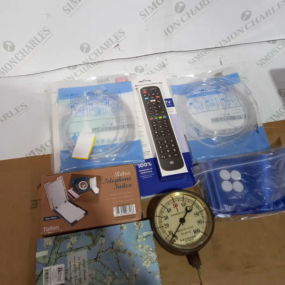 BOX OF ASSORTED HOUSEHOLD ITEMS TOO INCLUDE REMOTES AND WRITING BOOKS  